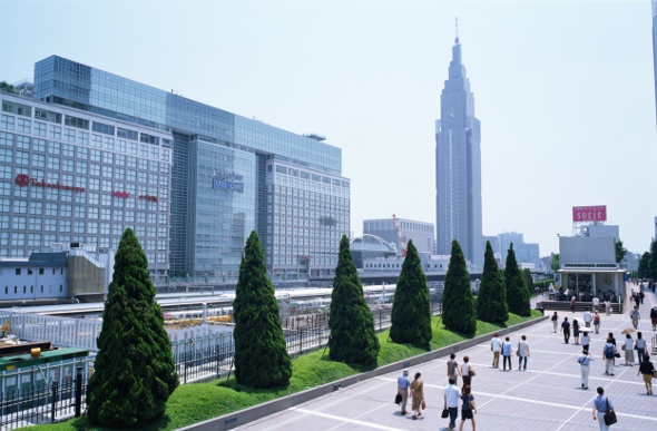 View of Takashimaya Times Square and Docomo Tower from the Grand Mall Park in Tokyo Japan