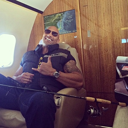  Dwayne 'The Rock' Johnson on board a private yet with a fishing rod 