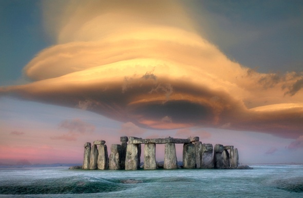 Stonehenge with a cloud formation above it
