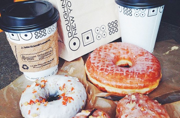  Two cups of coffee and three delicious Glazy doughnuts 