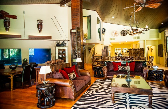 Safari-themed living and dining area with tribal furniture