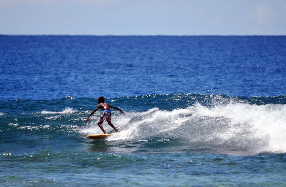 A young Vanuatu boy surfing