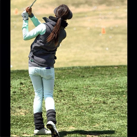 Back shot of Veronica Felibert in a golf course