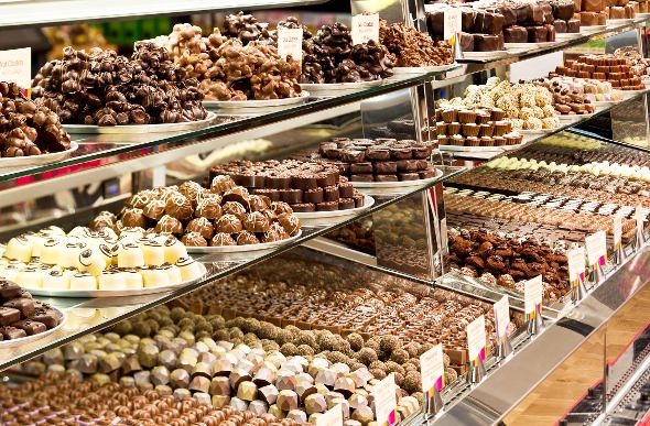  A cabinet containing a variety of milk, dark and white chocolate 