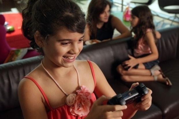 Young girl playing video games 