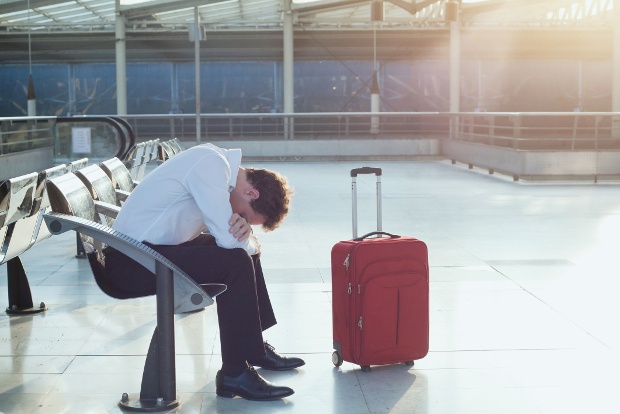 Sad business traveller at airport