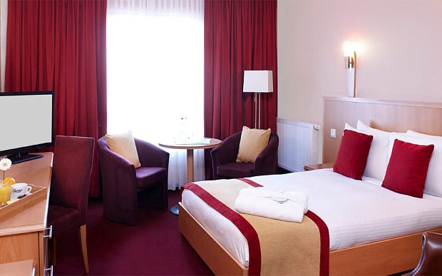 Hotel room with bed, couch and Tv