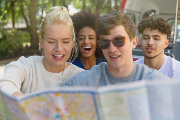 Group of friends looking at a map