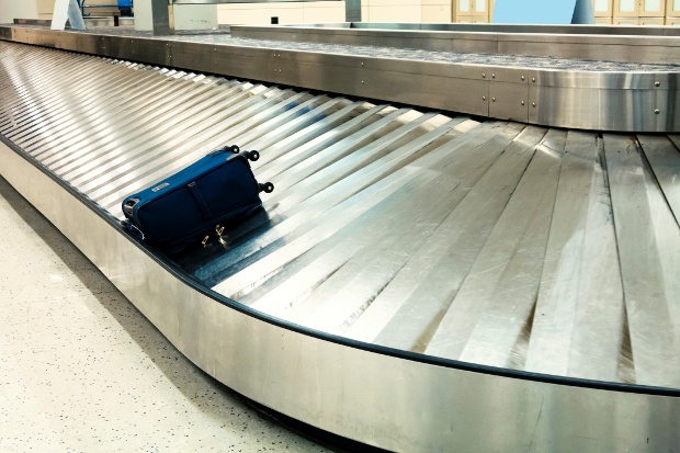 Baggage carousel with a single bag on it