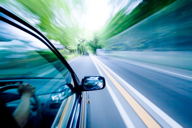 A car speeding on a highway