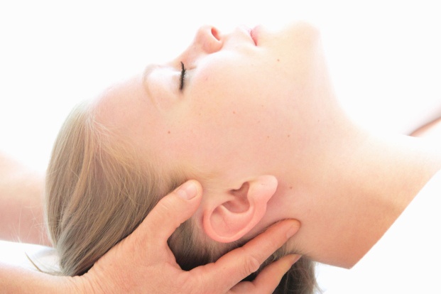 a woman sleeping while having a head massage