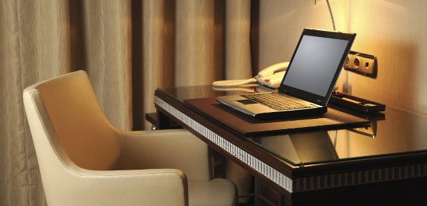 Work office space with a phone and laptop 