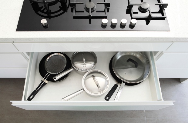 Open drawer with pots and pans 