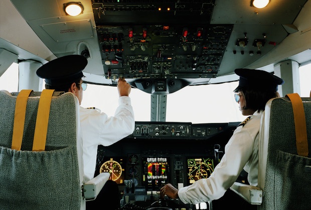 Pilot and co-pilot sitting in the cockpit of a plane