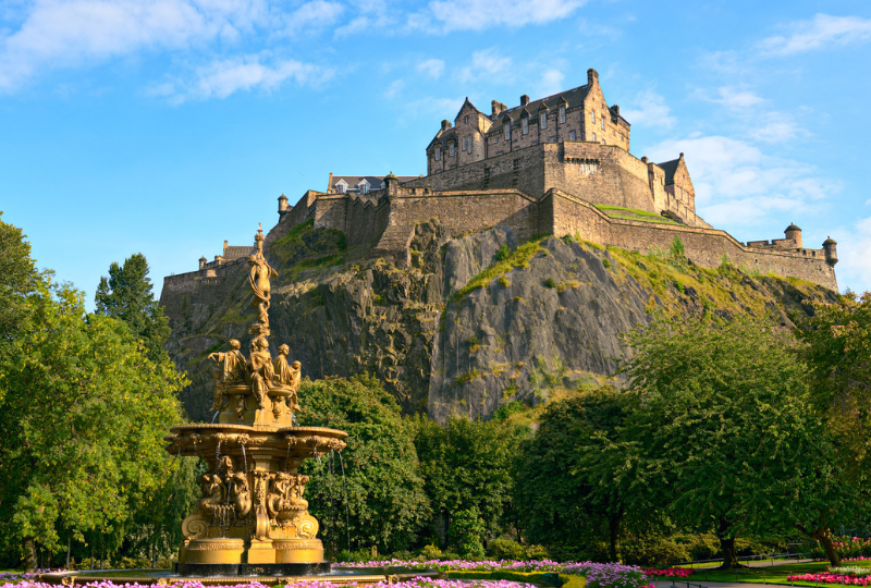 Golden Rose Fountain and the Edinburgh Castle at the background one of the historic infrastructure that can be found in Scotland.