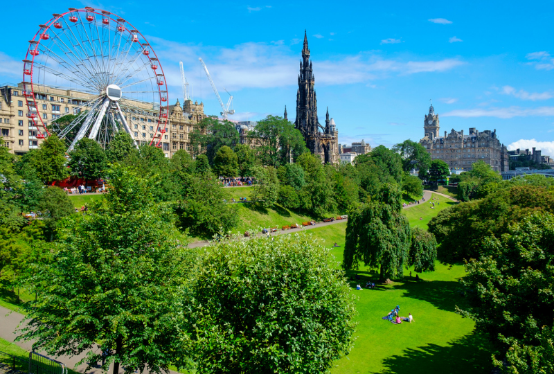 Amazing Ferris Wheel, beside is the Scott Monument in one of the parks in Edinburgh