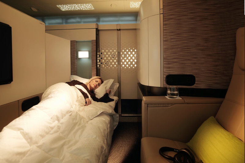 Woman asleep in first class Etihad apartment
