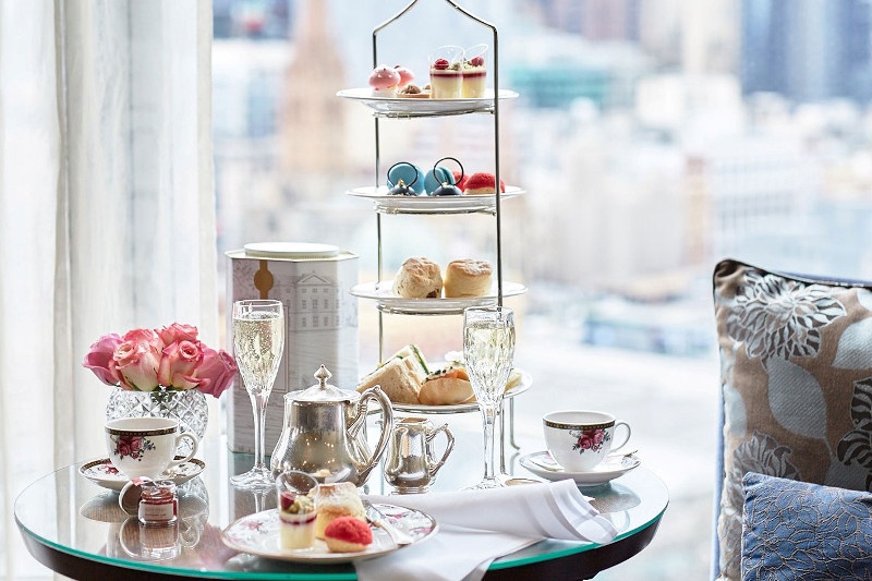 High tea and champagne served on a round table 