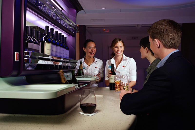 Waitress serving customers at the bar 