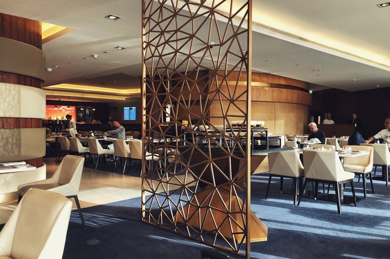 The light-filled dining area within the first class lounge in Abu Dhabi