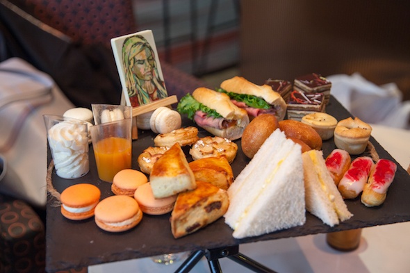 A plate of sweet and savoury high tea food at the Sofitel