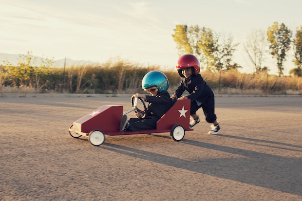 Young boys playing in a kart