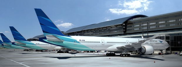 Some Garuda Indonesia planes lined up at the gates