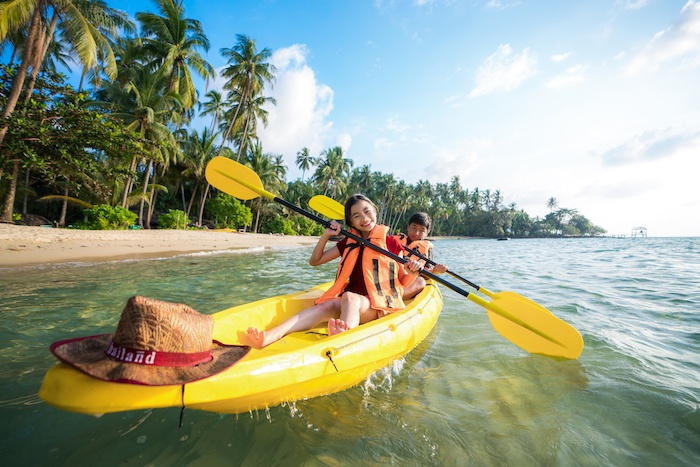 kids having fun kayaking in Thailand