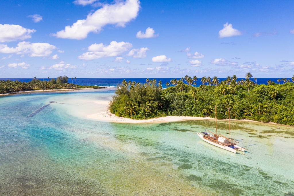 Muri Beach Surrounded by water and small island with different kinds of trees, its also popular turquoise beach best for swimming, snorkeling and water sports like kayaking.