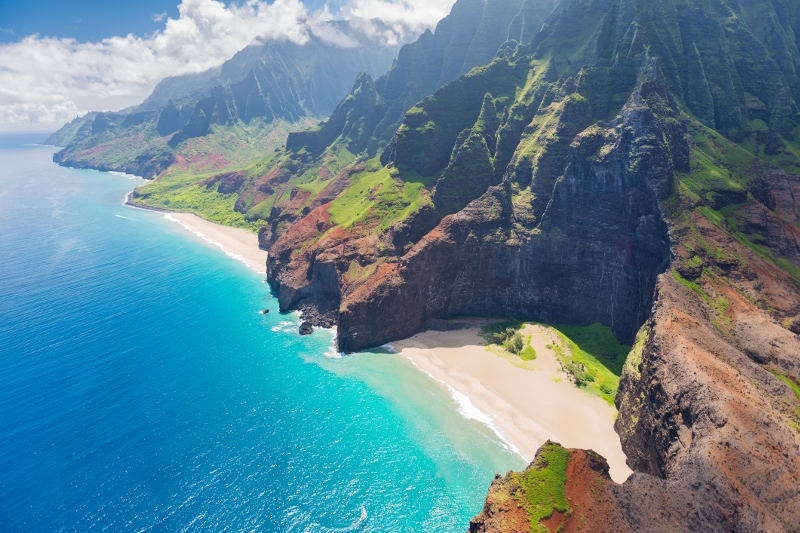 Aerial shot of mountains beside the ocean