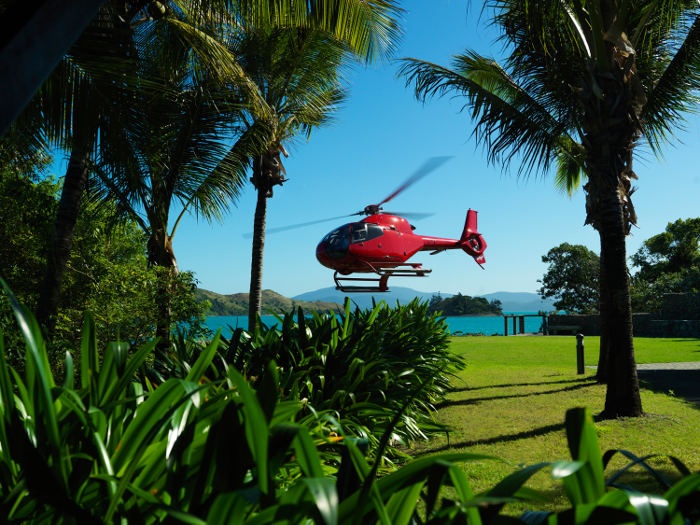 Helicopter flying over the ocean 