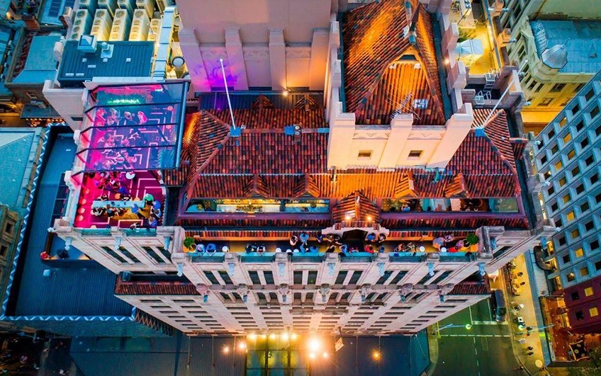 Birds eye view of the top of Mayfair hotel and hennessy rooftop bar
