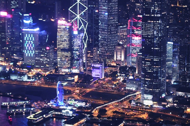 A night-time view of the Hong Kong cityscape.