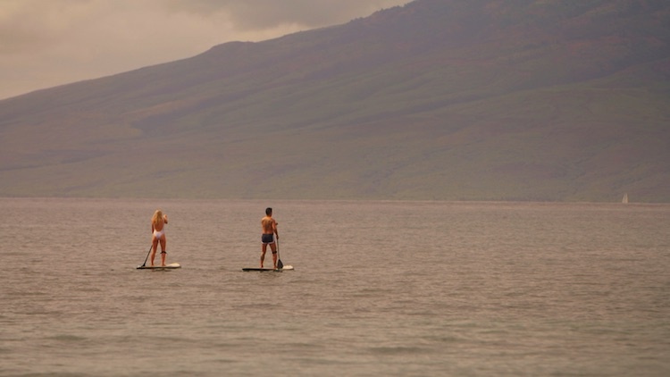 Greer and Jason paddle boarding at the Hyatt Regency Maui Resort &amp; Spa during The 48 Hour Destination: Hawaii. 