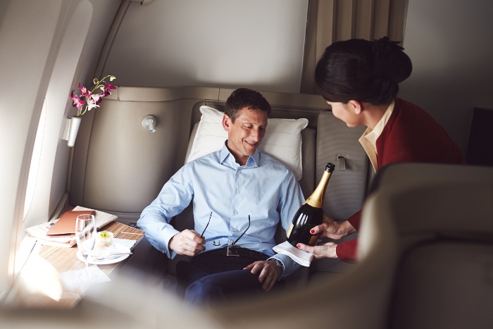 Champagne service in first class onboard cathay pacific