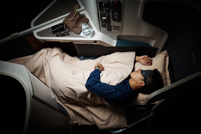 Cathay Pacific Business Class beds transform to full-flat for maximum comfort and rest.