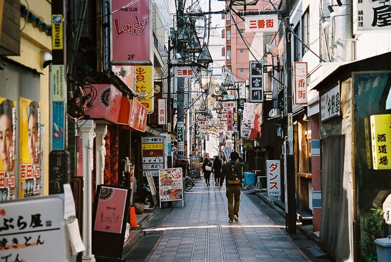 Narrow streets of Koenji filled with store signages