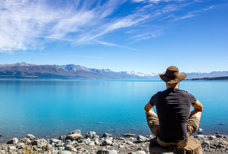 Man appreciating the scenic view of Lake Tekapo