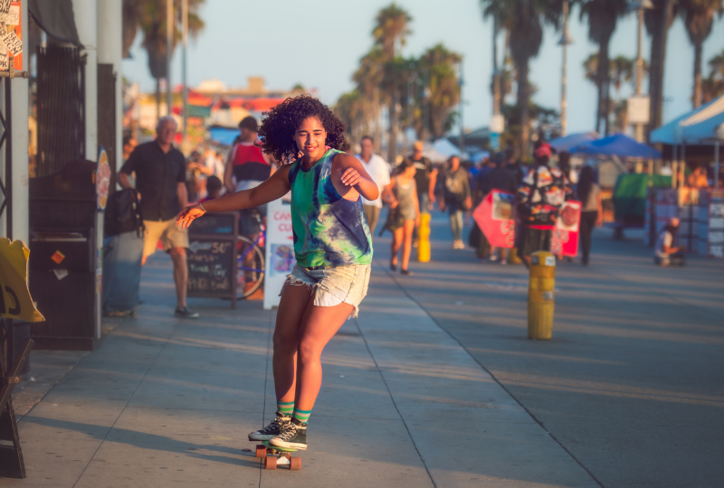 Woman on a skateboard chilling out in Venice beach
