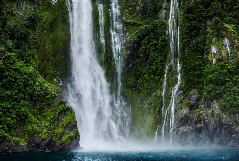 Waterfalls with leafy rock mountain