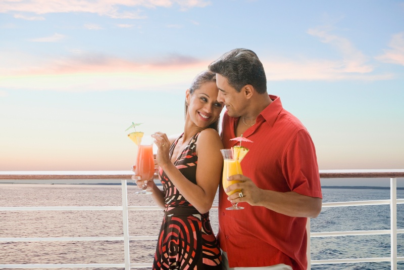 two passengers with colourful cocktails on a cruise ship 