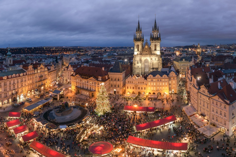 An aerial shot of the Prague Christmas markets. The cathedral is in the background