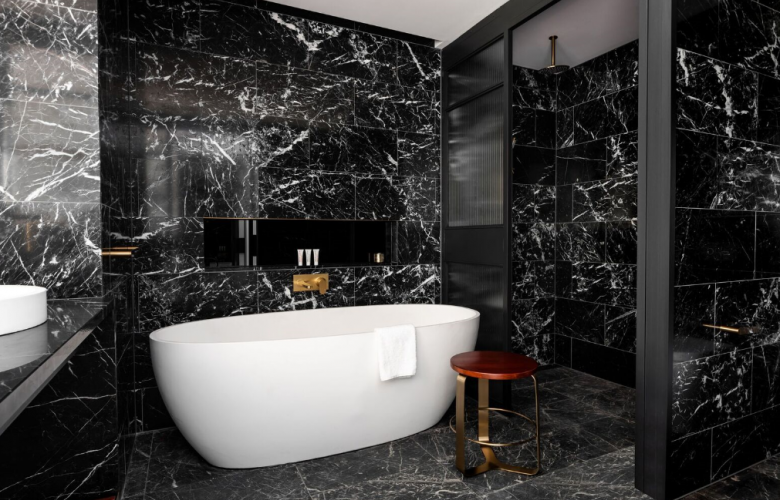 Luxurious marble-filled bathroom at the QT Perth Hotel