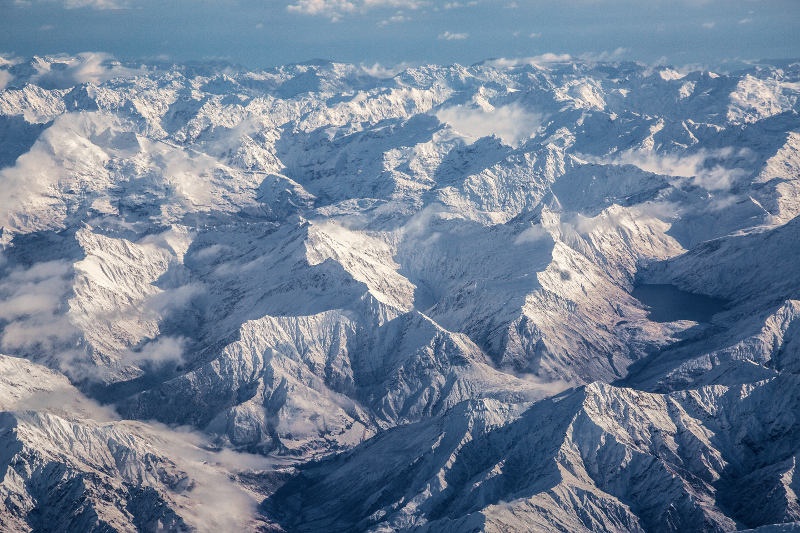 view of snow covered Queenstown mountains from the air