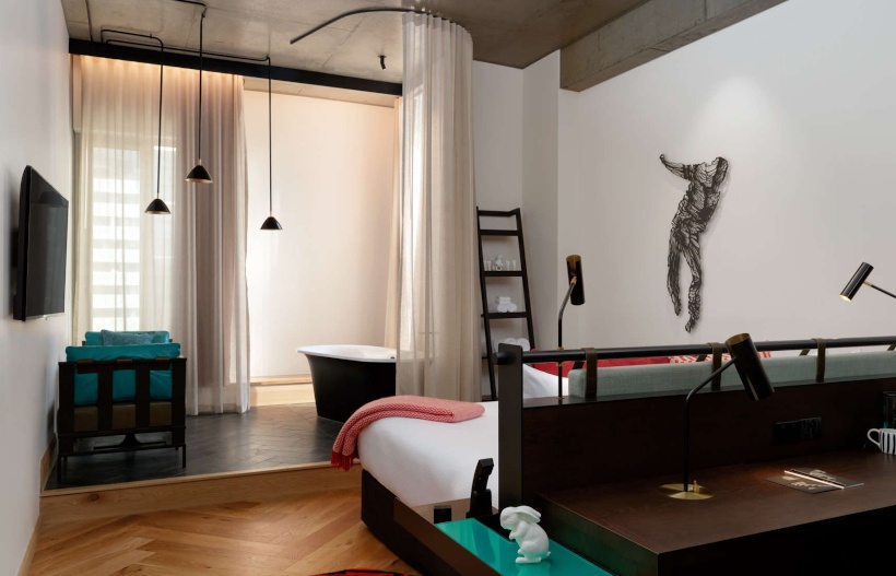 Room at QT melbourne. Artwork and quirky interiors as well as a free standing bathtub 