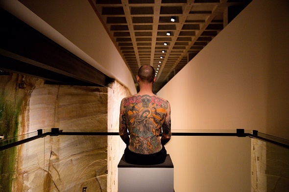 man with tattoos exhibit mona hobart