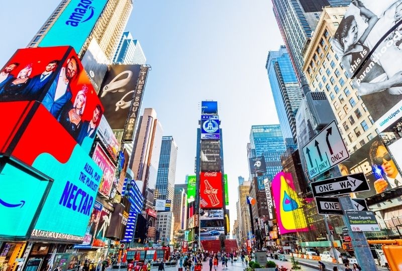 the new york times square with building filled with LED signage