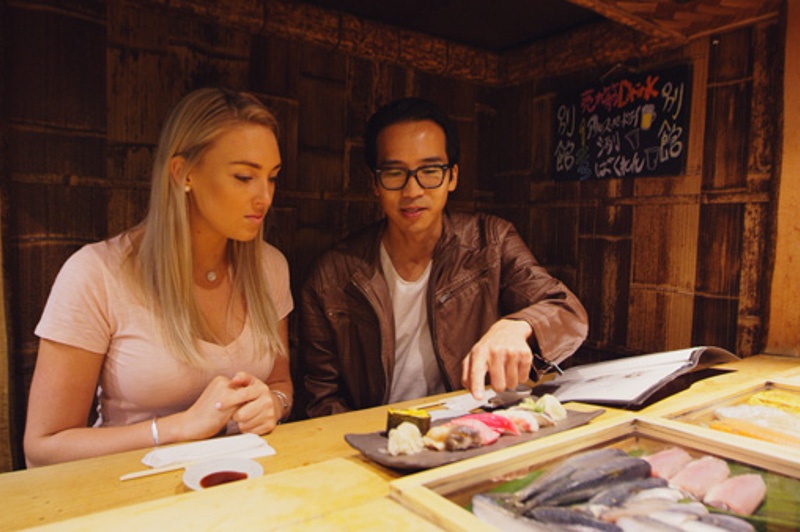 Greer and Keiichi in fish market restaurant, tokyo, japan