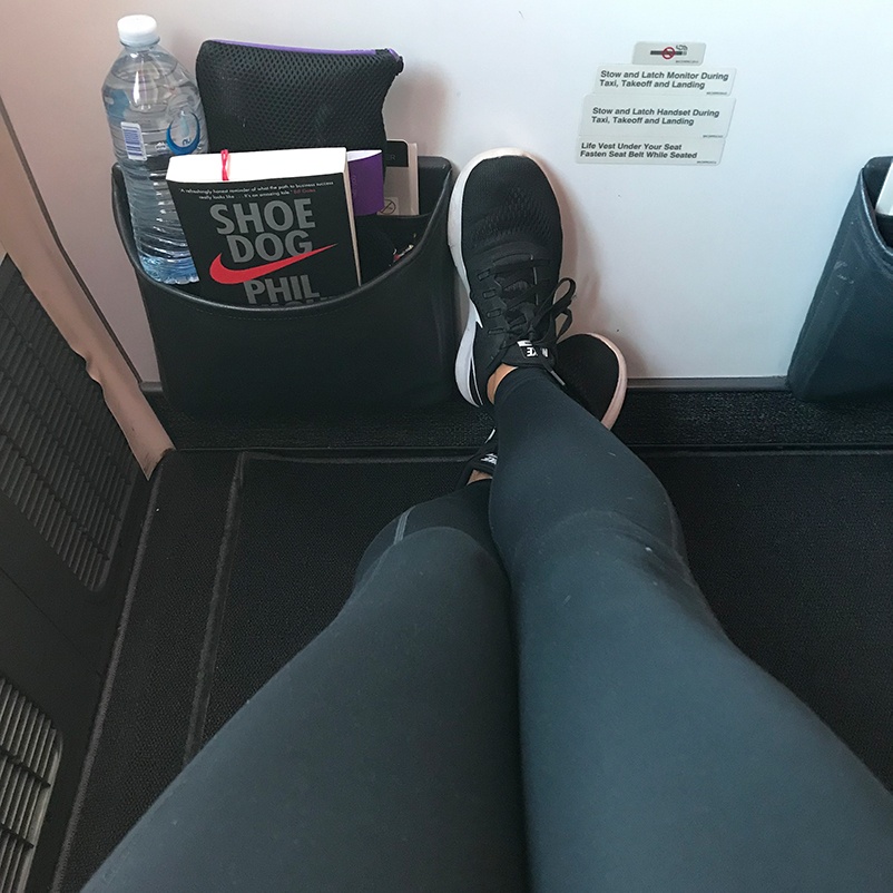 a person enjoying a spacious leg room inside a plane