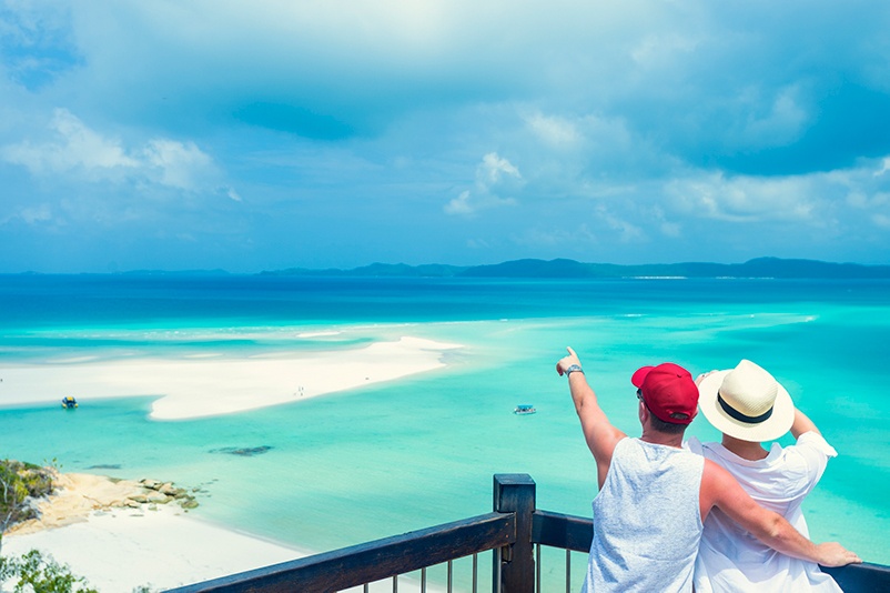 Couple look at beach in the Whitsundays